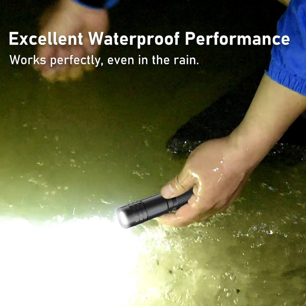 Peetpen L28 waterproof Tactical flashlight submerged in water, illuminating the surroundings