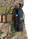 WUBEN flashlight in a black holder on a camouflage military belt